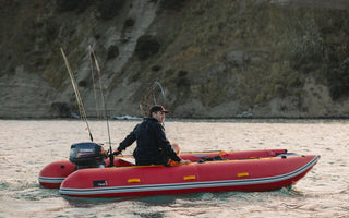 A man riding on an inflatable catamaran kit