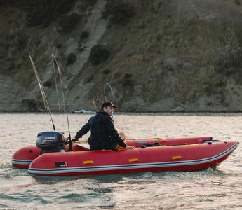 A man riding on an inflatable catamaran kit