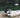 A man settipng up the electric outboard onto his dinghy