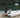 A man settipng up the electric outboard onto his dinghy
