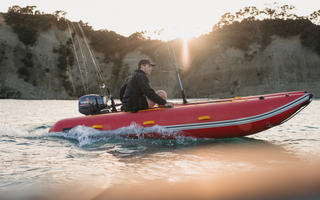 man riding a True Kit Lightweight inflatable boat