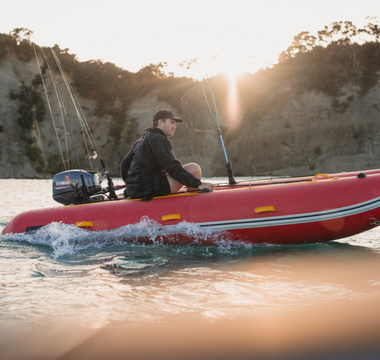 man riding a True Kit Lightweight inflatable boat