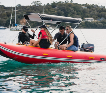 family on a boat with bimini top