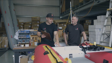 Image for Book Your Demo- Two men in a warehouse setting with equipment and supplies around them.